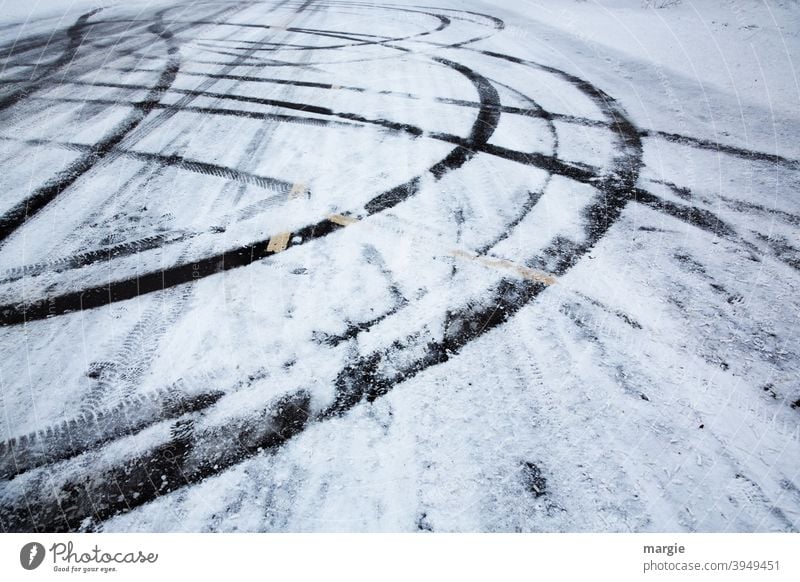 Tire tracks on a slippery road with snow and ice Street asfalt street as folded smooth Black ice Tracks Skid marks Subdued colour Detail Pattern Twilight Line