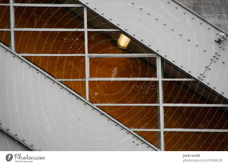 Covered upwards to the platform canopy Escalator Subway station Architecture Upward Diagonal Metal construction Lighting Intersection Window