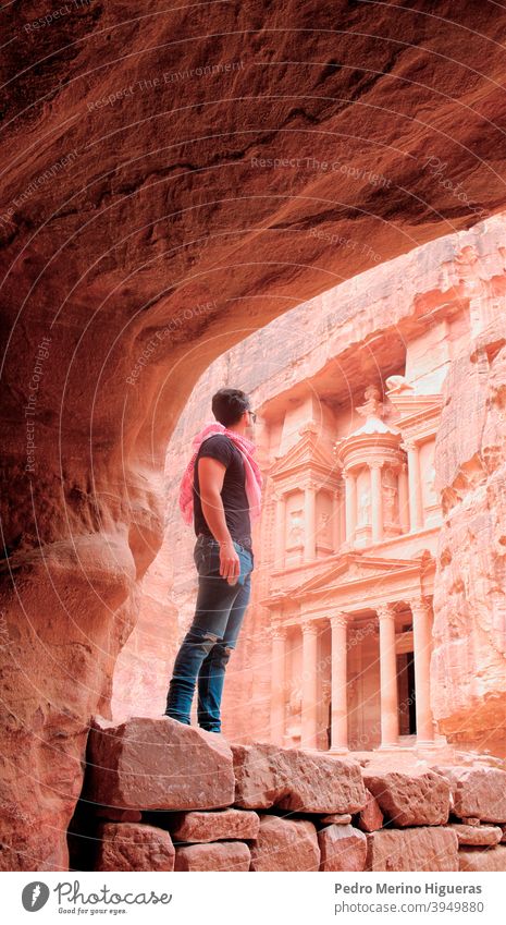 Person in the Treasure Of Petra petra jordan rock ancient desert gems ravines traveling sandstone landscape red tomb mountain city treasure history nature cavas