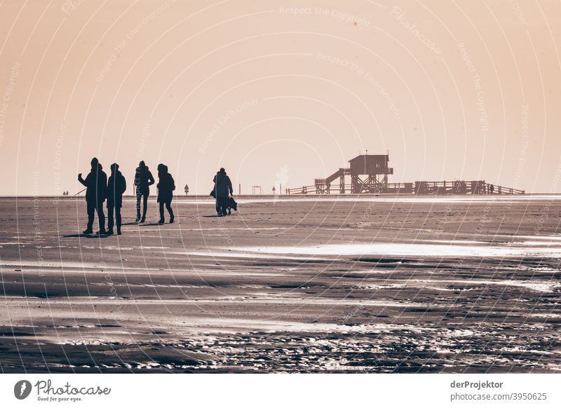 Noon in San Peter-Ording on the beach with poison stalls and people shadows XI Wide angle Panorama (View) Long shot Worm's-eye view Deep depth of field Sunrise