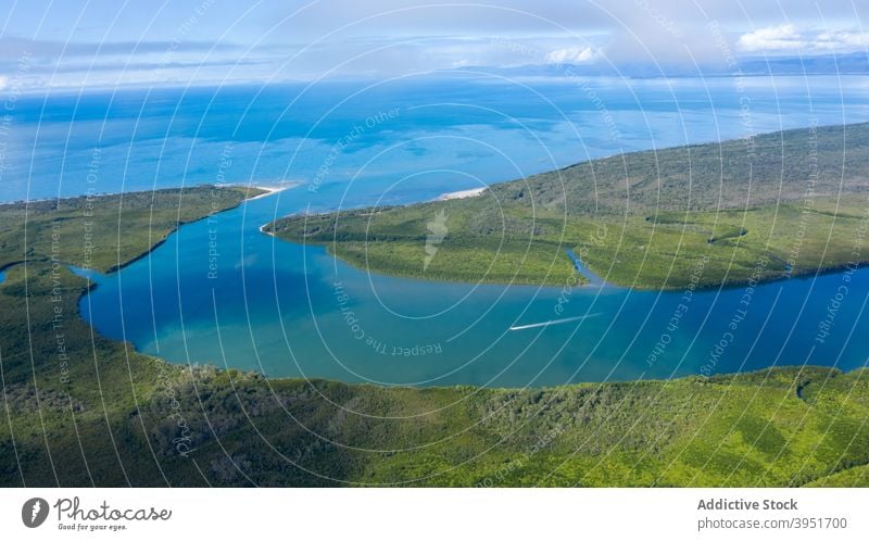 Scenic green island in river under sunset sky heart landscape countryside nature picturesque coast scenic forest tree vegetate australia lush water riverside