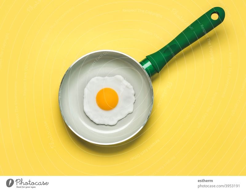 Fried egg on a green pan eggs cook meal lunch healthy yolk food protein diet cooking breakfast eggshell freshness fryer ingredient nutrition calorie tasty menu