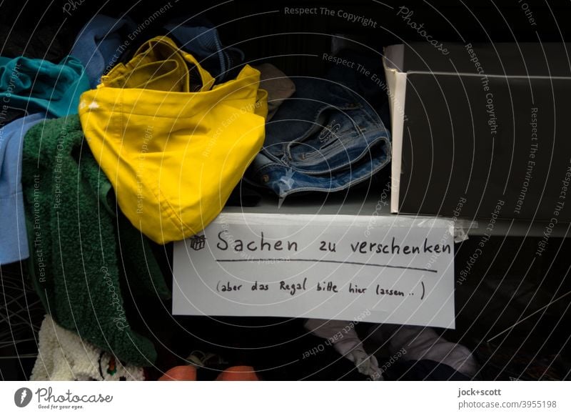 Things to give away (but please leave the shelf here..) garments Shelves Lifestyles Piece of paper Text Information Cardboard Muddled Offer Handwriting