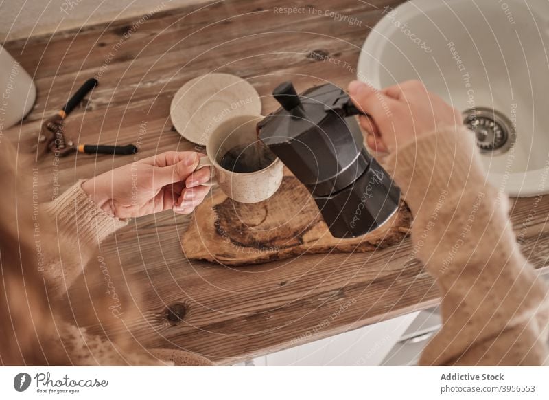 Smiling woman pouring coffee in cup morning breakfast geyser coffeemaker drink female kitchen moka pot hot home smile beverage fresh mug cozy caffeine brew