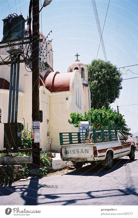 contrasts Electrical equipment Tree Electricity pylon Europe Religion and faith Car Cable Electronics Blue Sun Bright Muddled Street