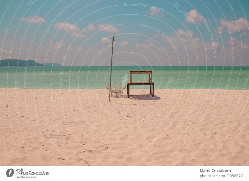 Scenic view of a lone beach chair against the blue sea and summer sky in Koh Rong Island in Cambodia koh rong island cambodia summer background sparse