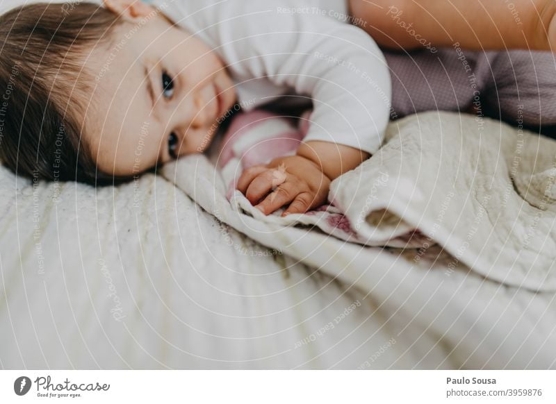 Toddler on the bed Bed lying Smiling Bedroom smiling home relax cute happy indoors bedroom kid Authentic Caucasian Home Lifestyle little care sweet pajama