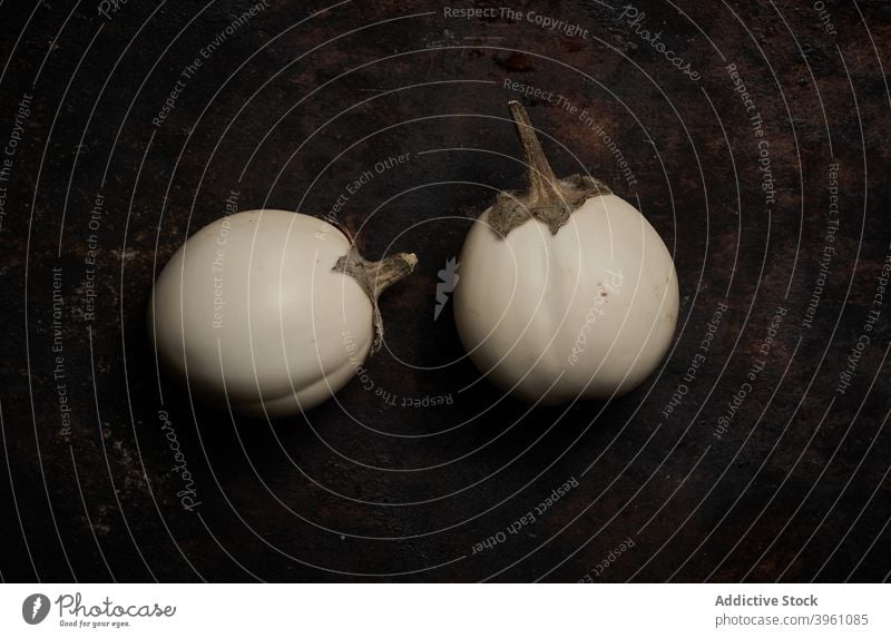 Top view of eggplants on rustic wood aubergine white vegetable healthy food nature fresh natural diet ingredient ripe coloration vegetarian kitchen isolated