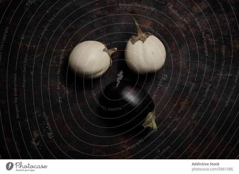 Top view of eggplants on rustic wood aubergine white vegetable healthy food nature fresh natural diet ingredient ripe coloration vegetarian kitchen isolated