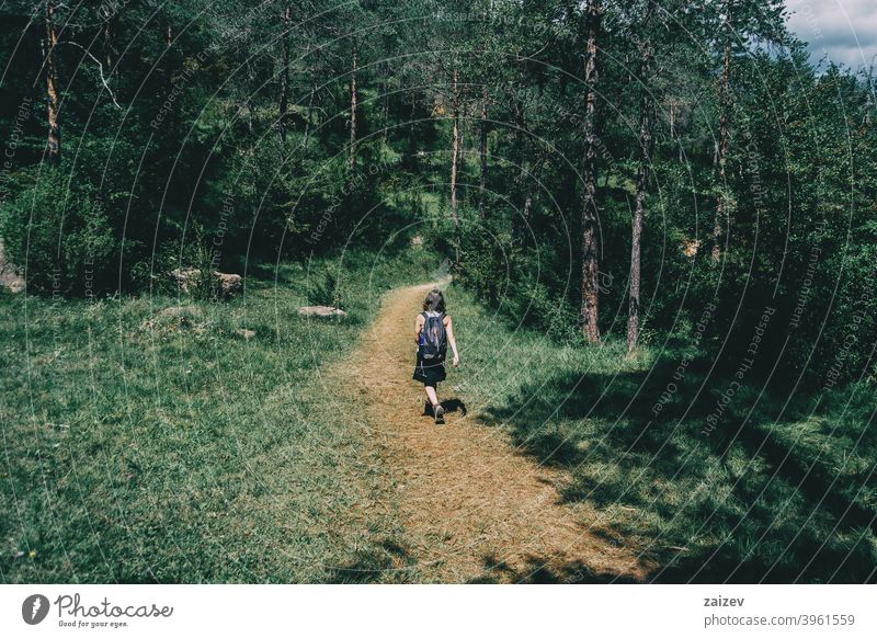 woman walking along a small path spain outdoor copy space color people female one person mountain freedom travel lifestyle nature healthy happiness hiking