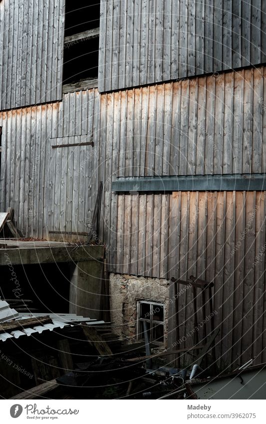 Rustic old facade of brown wood of an old barn on a farm in Rudersau near Rottenbuch in the district of Weilheim-Schongau in Upper Bavaria Wood Brown Facade