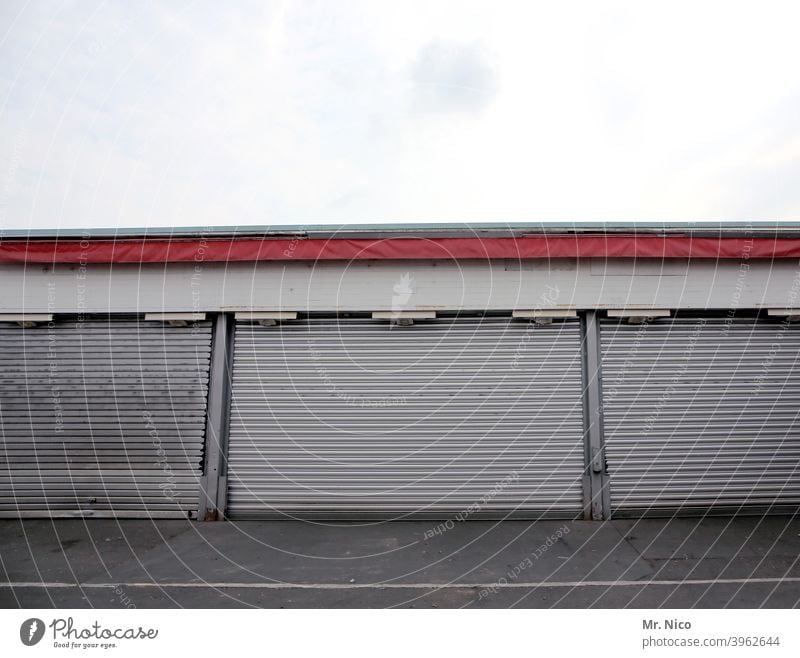 warehouse Goal Storage Warehouse Depot Wholesale market Building Trade Entrance Gloomy Closed Rolling door Stock of merchandise Garage Garage door come down