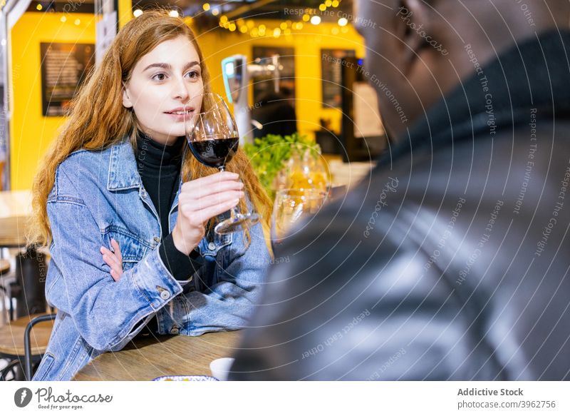 Multiethnic couple drinking wine in cafe date love alcohol romantic relationship together multiethnic multiracial diverse black african american table beverage