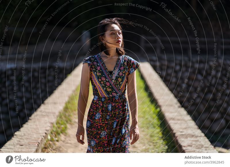 Woman standing on bridge in forest woman summer vacation carefree relax brick aged heritage female daping red bridge taiwan travel trip tourist enjoy style