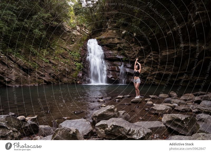 Traveling woman near waterfall in woods traveler tourism summer vacation rock scenery relax lake tiemu falls tiemu waterfall taiwan nature stone trip forest