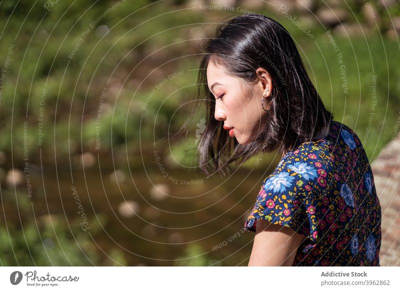 Asian woman in nature in summer calm tranquil sunny relax natural appearance beauty female asian ethnic taiwan peaceful daytime young rest enjoy harmony serene