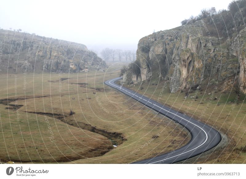 winding roads in a small canyon Mountain Nature Day Colour photo mountains Forest woods Roadside Winding road travelers Landscape form Street Lifestyle