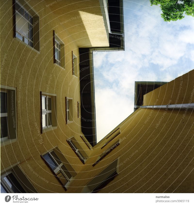 The Eckzorzist continues Corner berlin corner apartment building Staircase Facade Window Backyard Eaves Sky facade color Yellow roughcast symmetric Clouds