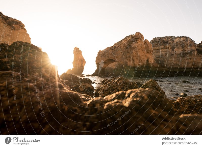 Waving water and cliffs at sunset sky nature bay evening algarve portugal sea rough harmony serene coast sundown peaceful picturesque scenic twilight cloudless