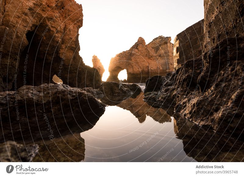 Calm water and cliffs at sunset sky nature calm reflection bay clean evening algarve portugal sea rough harmony serene coast sundown peaceful picturesque scenic