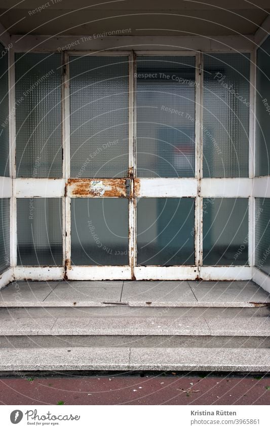 Rusty entrance door Glass door Entrance Front door Access door handle rusty Old Stairs stagger School Authority official Building Architecture Weathered Patina