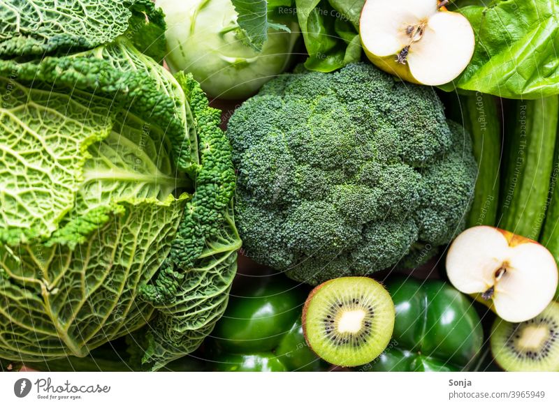 Top view of green raw vegetables and fruits Vegetable Green Raw Vegetarian diet Organic produce Healthy Vegetable market Fresh Farmer's market Greengrocer