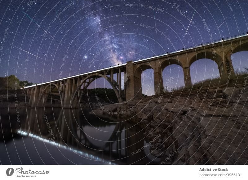 Viaduct under starry sky at night viaduct landscape bridge spectacular milky way galaxy dark glow illuminate light sparkle dusk astronomy scenic shiny luminous