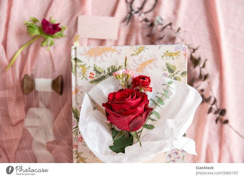 Small bouquet of red  roses, top view white paper flower flowers pastel background isolated valentine day pink green spring floral summer beautiful plant