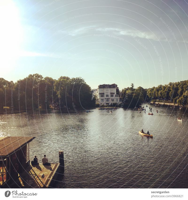 Someday we will paddle romantically together into the sunset again or sit at the boathouse without distance. Summer Hamburg Alster warm Love Affection Paddling