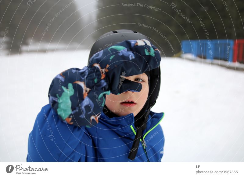 little child looking at the camera in a winter landscape rebellion Rebel Child people Language concept positive Expression symbol directly Conceptual design