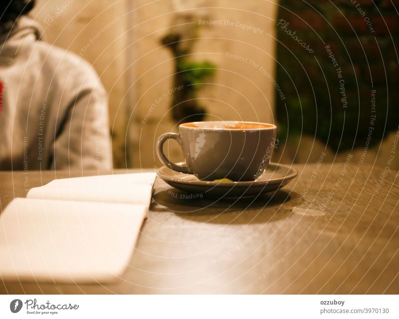 cup of cappucino at cafe mug table caffeine cappuccino drink background liquid white milk beverage empty hot latte breakfast brown night close closeup coffee