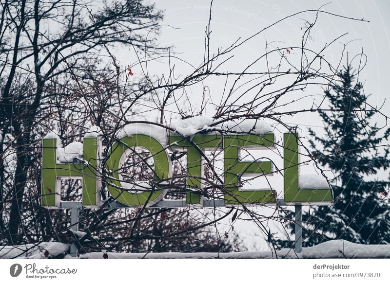 Hotel sign covered with snow Winter mood Winter vacation Esthetic Snow Exceptional Copy Space middle Sunlight Copy Space bottom Copy Space top Deserted