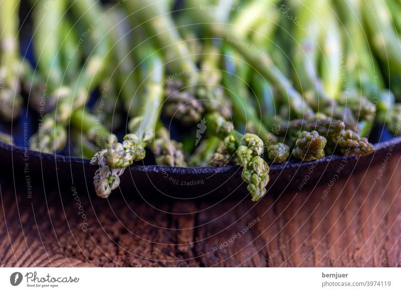 green asparagus in an iron skillet Asparagus boil salubriously Eating Green Pan Kitchen Fresh vegetarian Preparation Vegetable ingredient background Nutrition