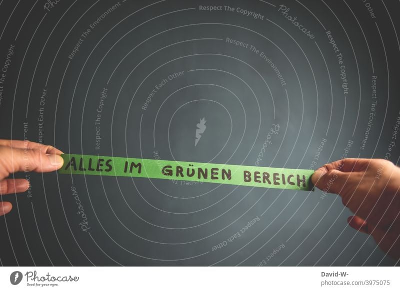 Everything in the green area - man holds note with inscription in the hand - think positively Positive Optimism optimistic Green Hope Contentment convalescence