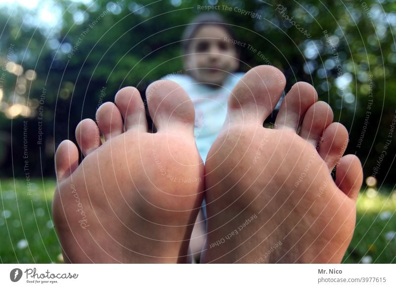 Girl sits barefoot on a meadow Lie Barefoot Summer Feet Skin Toes Relaxation Goof off Bum around Cozy Environment Contentment Summery Comfortable Grass Nature