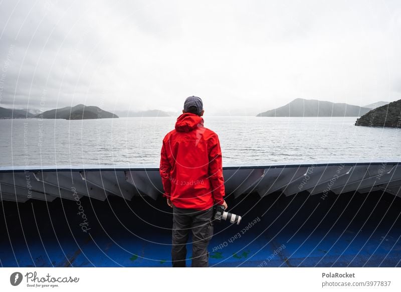 #AS# Land in sight Navigation Red camera Exterior shot Blue Ocean Sky coast Islands Railing Wide angle Hope Future North Island Ferry Crossing travel