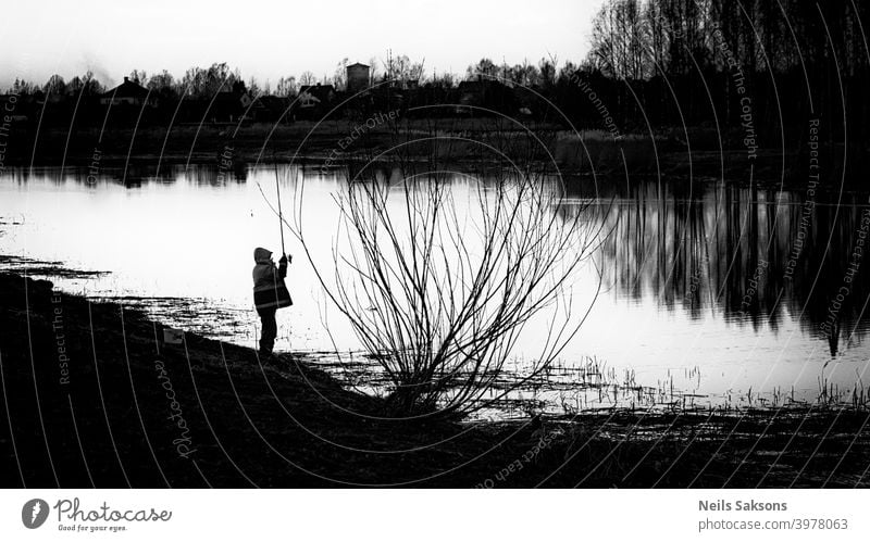 fish is not essential / relaxing by the river after spring floods Action activity angler blur calm dark dusk evening fisherman fishing freedom golden hobby