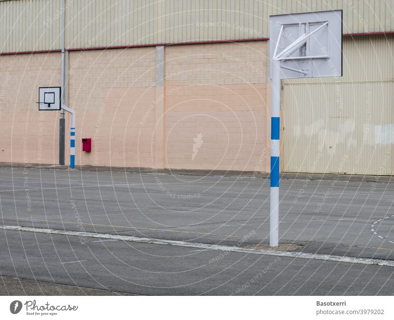 View of basketball court made of concrete and asphalt. Schoolyard in Vitoria, Basque Country, Spain Basketball Playing field Concrete Asphalt Hard Gray nobody