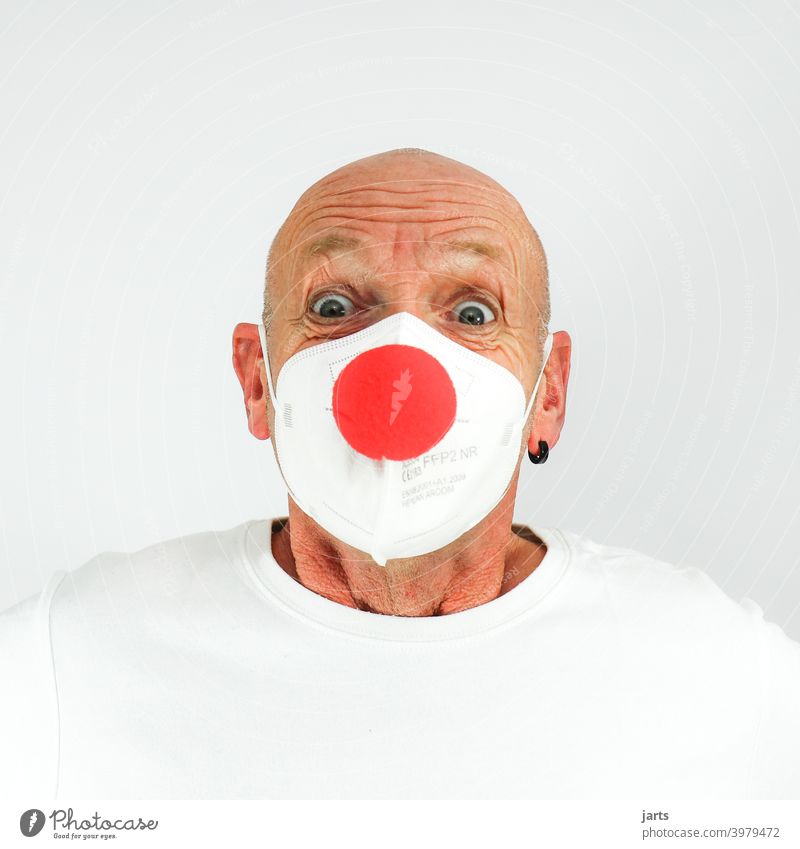 Funny man with FFP2 mask and red clown nose Mask ffp2 mask Mouth and nose mask Laughter Nose carnival Carnival eyes crease Protection covid-19 pandemic Optimism