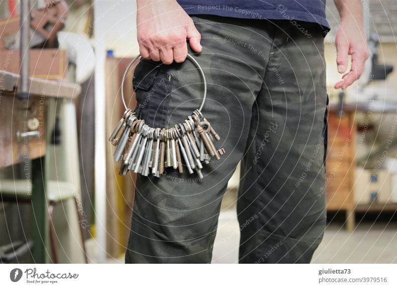 Janitor at work - with big bunch of keys in hand Key Workshop Craftsperson Work and employment Profession Interior shot Workplace Hand hands Colour photo Tool