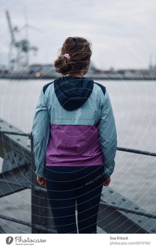 Beautiful view Harbour Port City Hamburg Water back view Track-suit top Cold Woman Curl Braids Exterior shot Elbe Wait Colour photo Vantage point