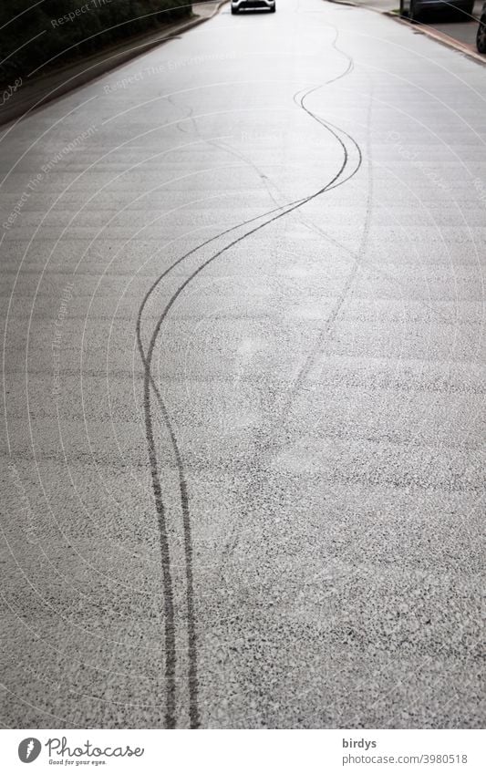 Lane of a bicyclist who was riding in a serpentine fashion. Alcohol on the road trace Wavy lines bicycle lane Street drunken Road traffic Bicycle curvy Cycling