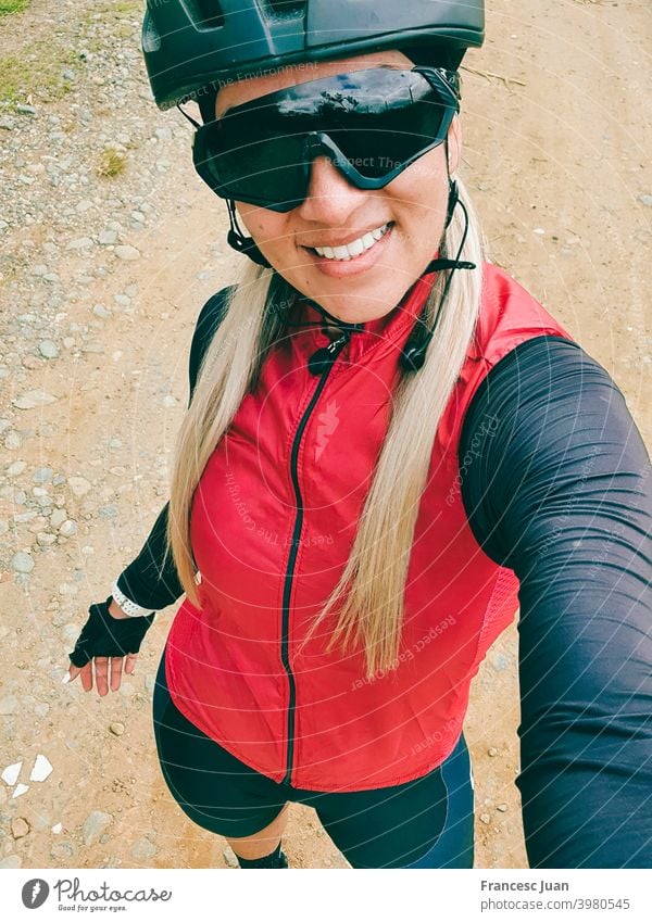 Beautiful cyclist woman selfie training in the mountain. smile cycling young portrait people hat child kid person happy teen fashion beauty smiling white cap