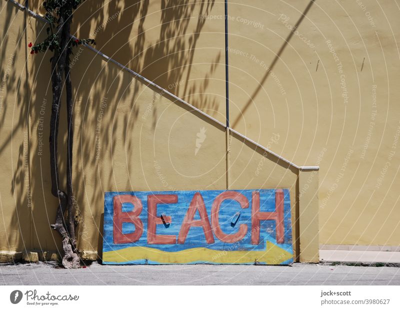 Painted wooden sign with directions to the beach Clue Wooden board Word Beach Self-made Arrow Tree trunk Shadow play Staircase Architecture Wall (building)