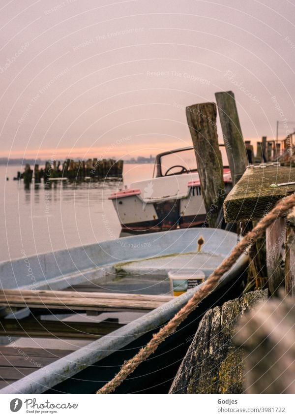 Old boats moored at the jetty Navigation Wood Rope Dew travel Water Sky Harbour Maritime Exterior shot Deserted Watercraft Fishing boat Day ship Close-up