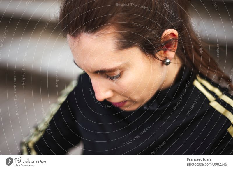 Portrait of young woman in white sportswear behind wood stairs at park. active lifestyle adult autumn beautiful people beautiful woman close-up cloudy weather