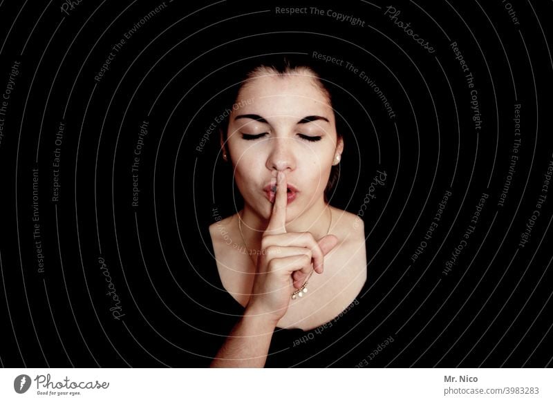 don't say a word silent psst mystery Fingers quiet keep quiet Gesture Silent Calm portrait Studio shot Shadow Confidant Facial expression Noise Caution