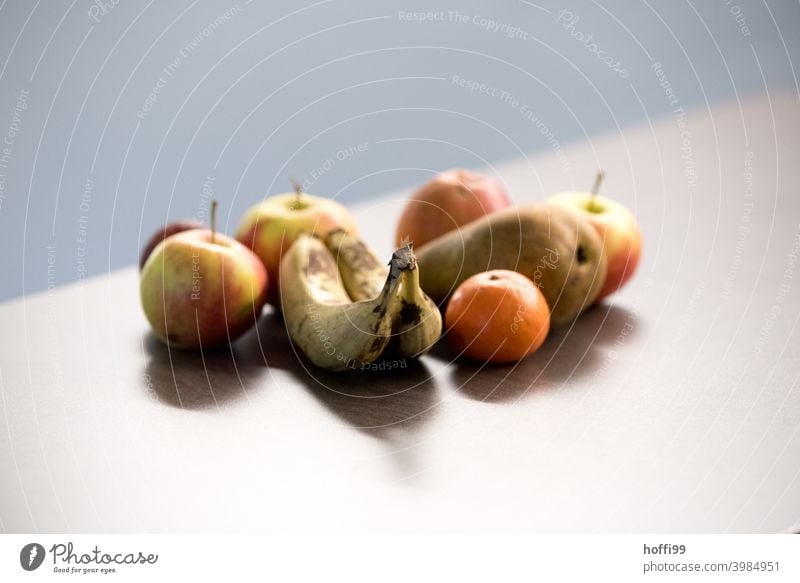 fruits on table at the office Fruit Banana Apple Mandarin Pear Nutrition Food Vegetarian diet Organic produce Healthy Delicious Fresh Deserted Juicy Day