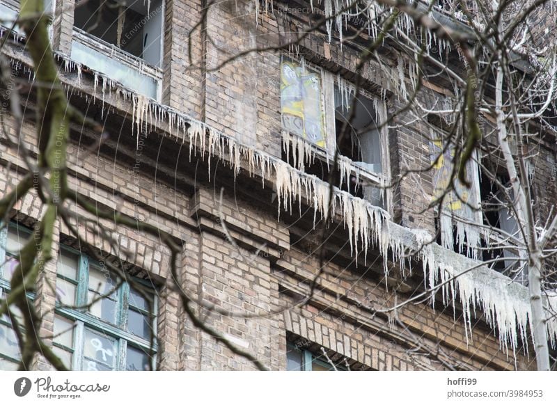 The extinguishing water forms icicles - after the winter fire Icicle renovation case Blaze Water damage Old building domestic fire in need of rehabilitation