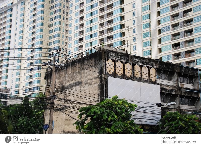 architectural change in the city Facade Bangkok Tower block Thailand Town house (City: Block of flats) Ravages of time Change Past Modern architecture